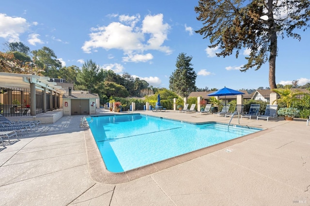 view of swimming pool featuring a patio