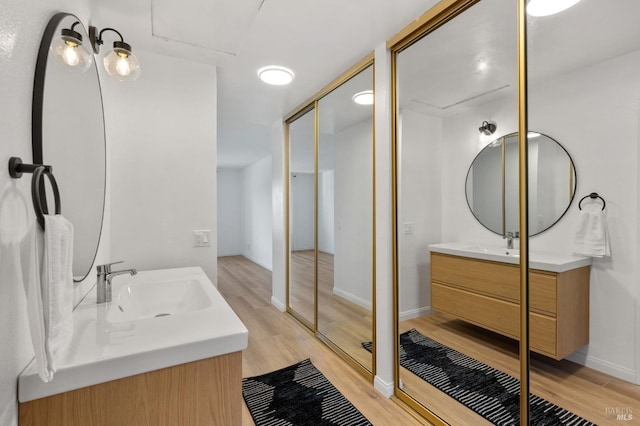 bathroom with wood-type flooring and vanity