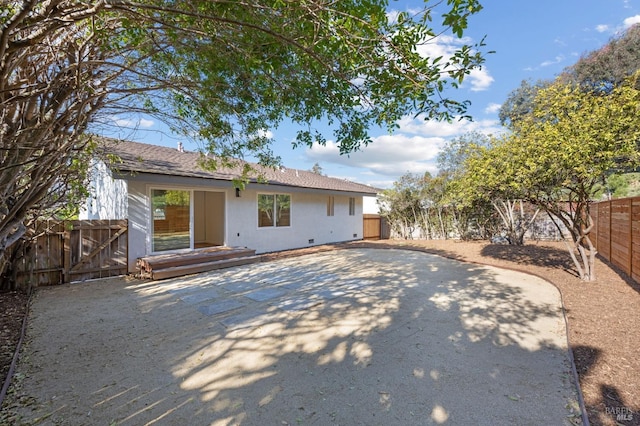 rear view of property featuring a patio