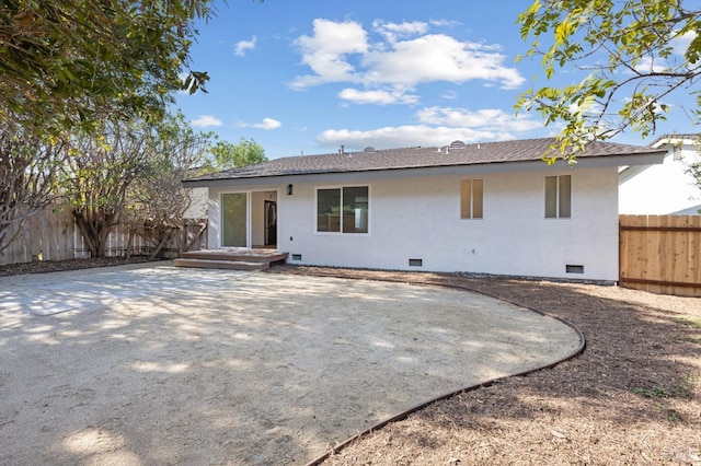 rear view of property featuring a patio area