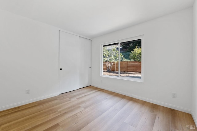 spare room featuring light hardwood / wood-style floors