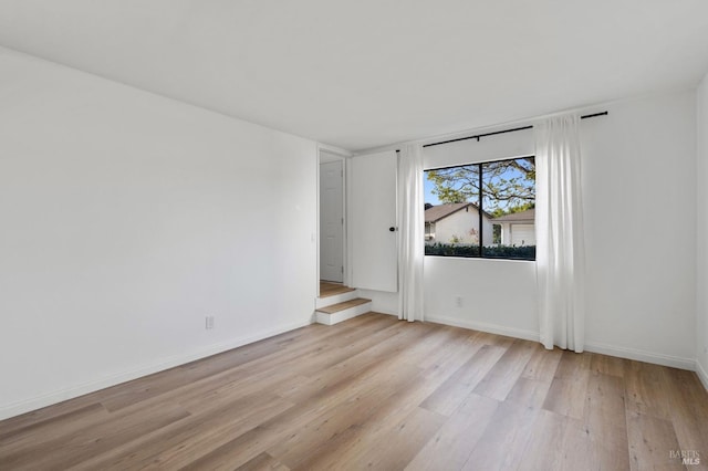 unfurnished room featuring light wood-type flooring