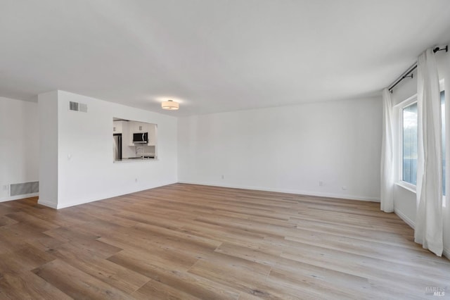 empty room featuring light hardwood / wood-style floors