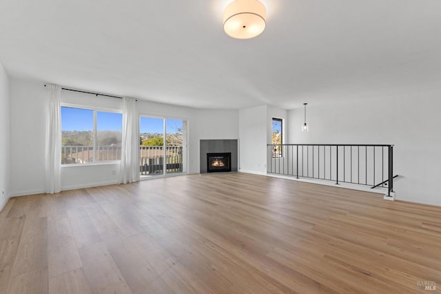 unfurnished living room with light hardwood / wood-style floors