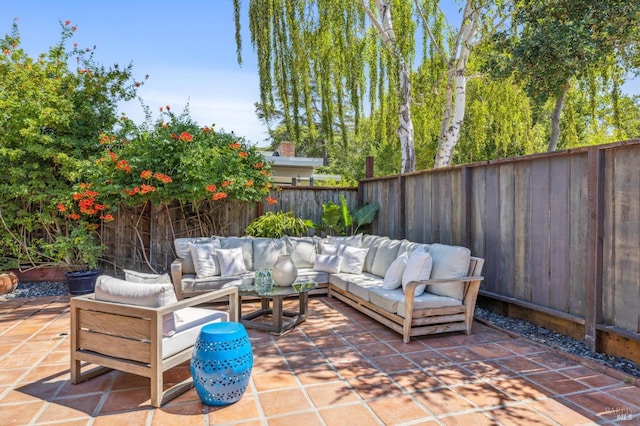 view of patio with outdoor lounge area and a fenced backyard