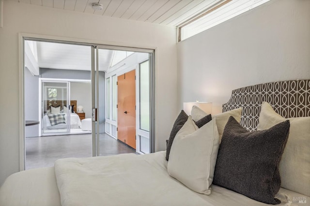 bedroom with multiple windows and wood ceiling