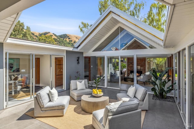 view of patio / terrace with outdoor lounge area and a mountain view