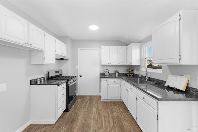 kitchen featuring sink, hardwood / wood-style flooring, stainless steel range with gas cooktop, and white cabinets