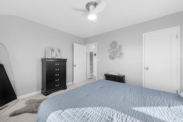 carpeted bedroom featuring lofted ceiling and ceiling fan