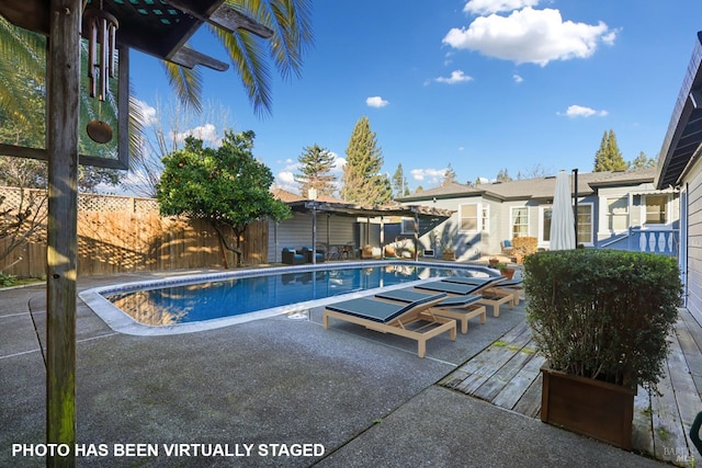 view of swimming pool with a patio area