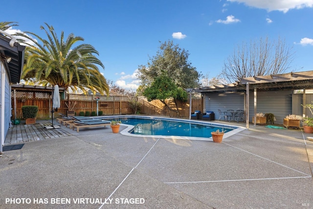 view of pool with a pergola and a patio