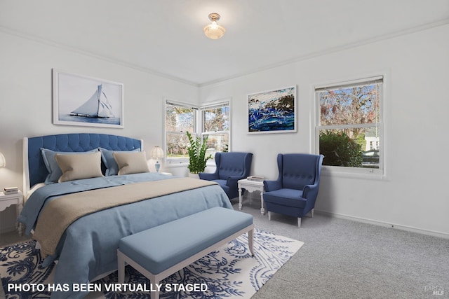 bedroom featuring crown molding and carpet flooring