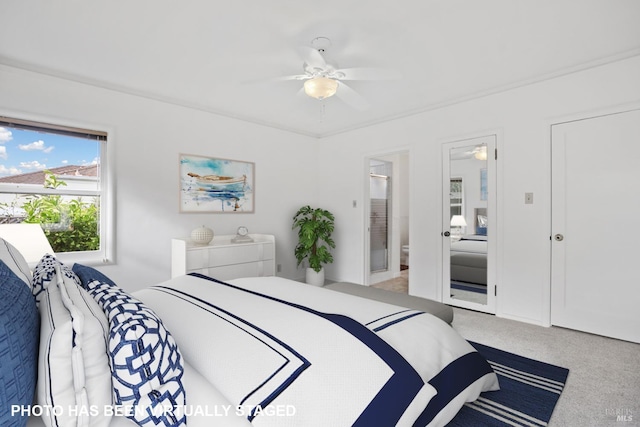 bedroom with ceiling fan and carpet flooring