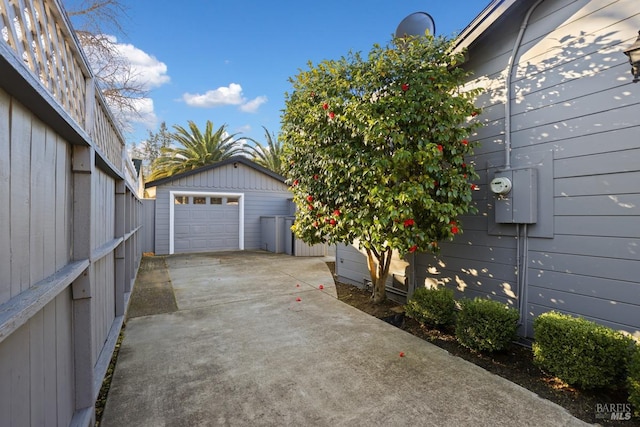 exterior space with a garage and an outdoor structure