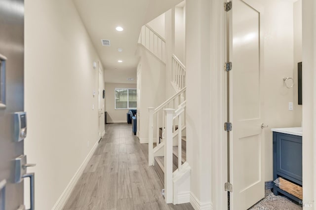 living room with hardwood / wood-style floors and crown molding