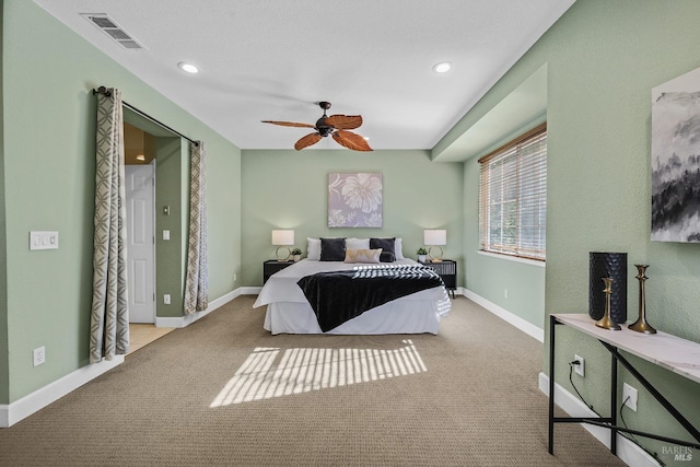 carpeted bedroom featuring ceiling fan