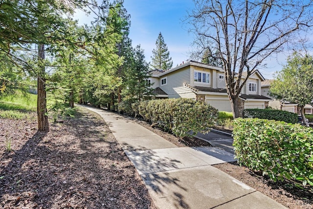 view of side of property featuring a garage