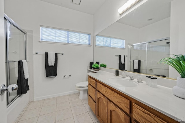 full bathroom featuring tile patterned floors, toilet, vanity, and a wealth of natural light