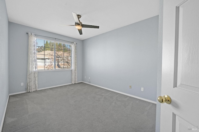 carpeted empty room with ceiling fan