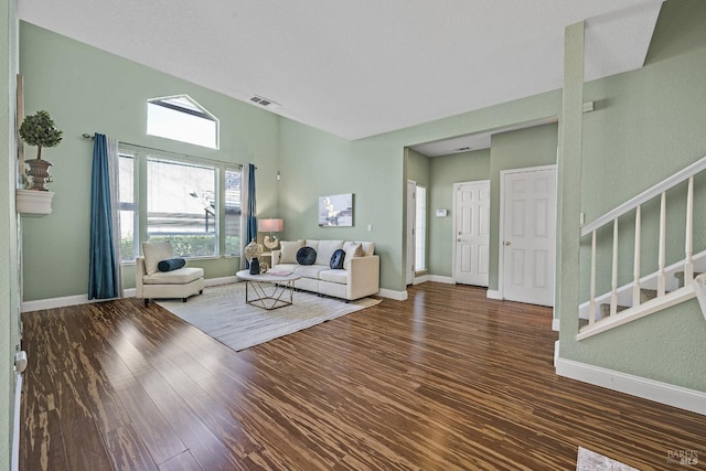 unfurnished living room featuring dark hardwood / wood-style floors