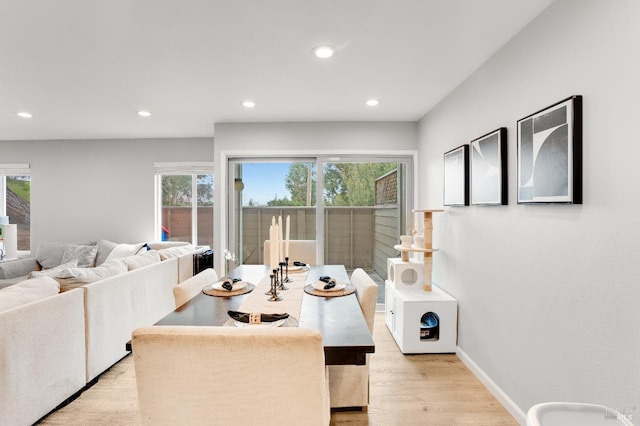 dining area featuring light wood-type flooring