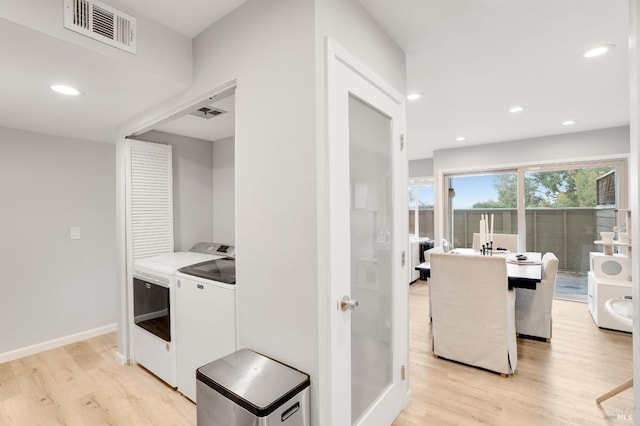 kitchen featuring light hardwood / wood-style flooring and washer and dryer