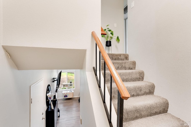 stairway with wood-type flooring