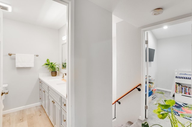 bathroom featuring hardwood / wood-style flooring and vanity