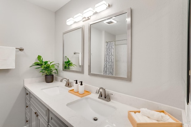 bathroom with vanity and a shower with shower curtain