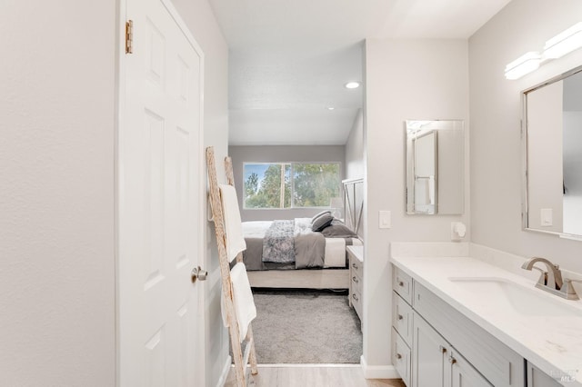 bathroom featuring vanity and hardwood / wood-style floors