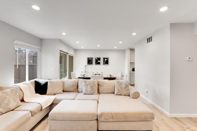 living room with light hardwood / wood-style flooring