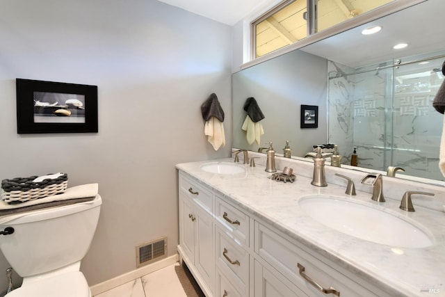 bathroom featuring vanity, an enclosed shower, and toilet