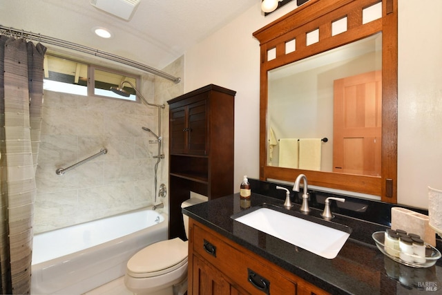 full bathroom with vanity, shower / bath combination with curtain, and toilet