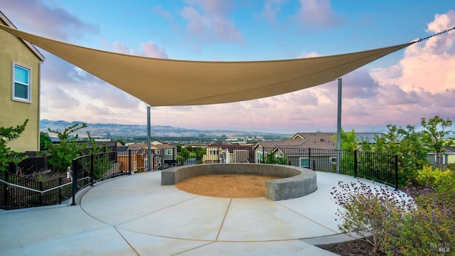 patio terrace at dusk with a mountain view