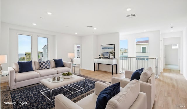 living room with light hardwood / wood-style flooring