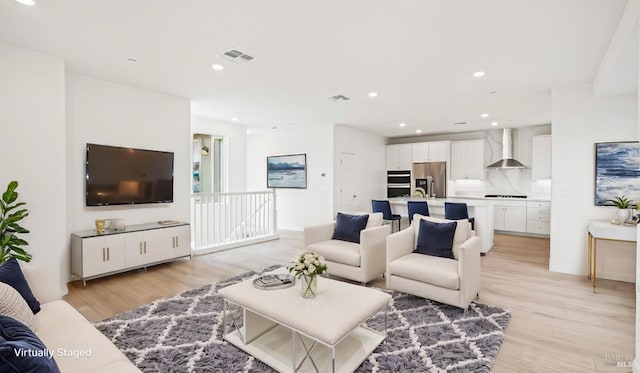 living room with light hardwood / wood-style flooring