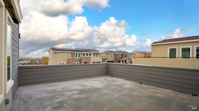 view of patio featuring a balcony