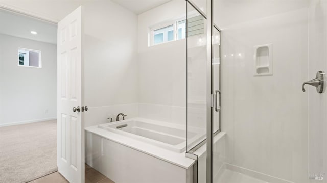 bathroom featuring independent shower and bath and tile patterned floors