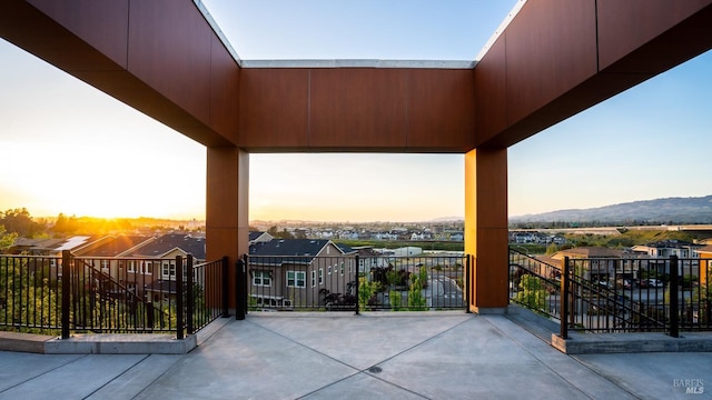 patio terrace at dusk with a mountain view