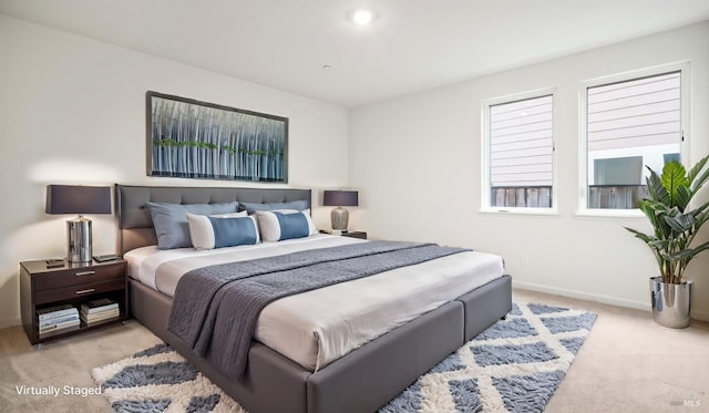 bedroom with light colored carpet