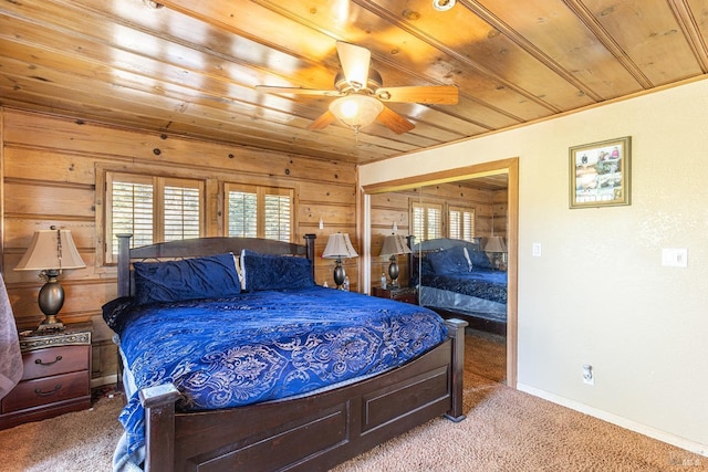 bedroom featuring wooden walls, light carpet, and wooden ceiling