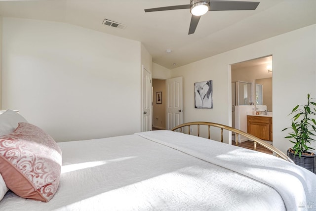 bedroom with sink, vaulted ceiling, ceiling fan, and ensuite bathroom