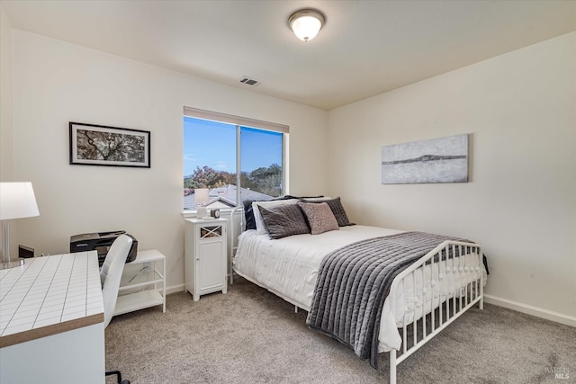 bedroom featuring light colored carpet