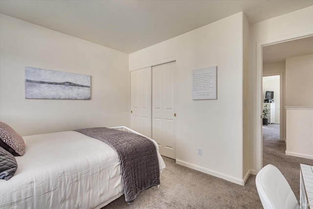 carpeted bedroom featuring a closet