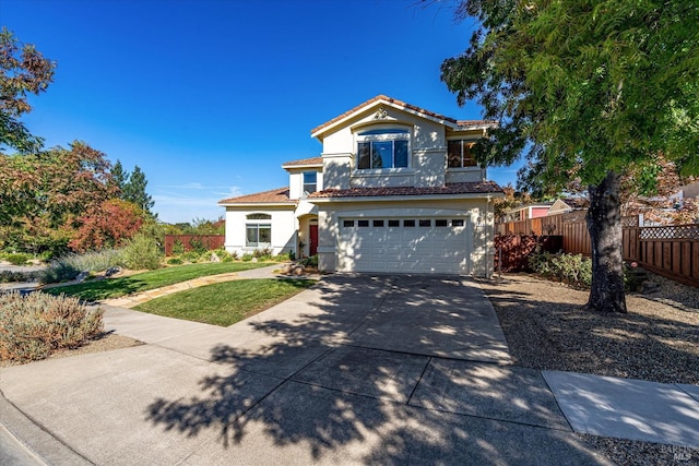 view of front of property featuring a garage and a front lawn