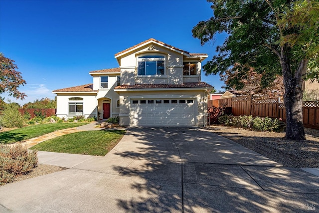 mediterranean / spanish house featuring a garage