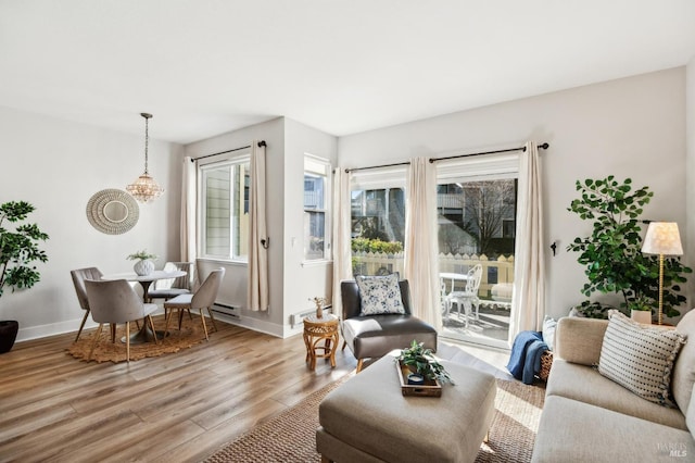 living room featuring a wealth of natural light and light wood-type flooring