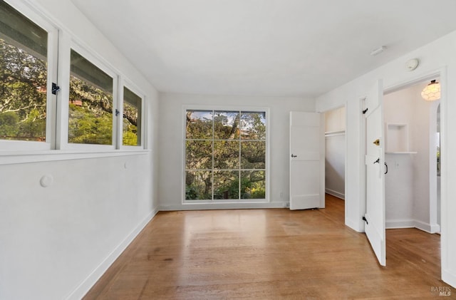 spare room featuring light hardwood / wood-style floors