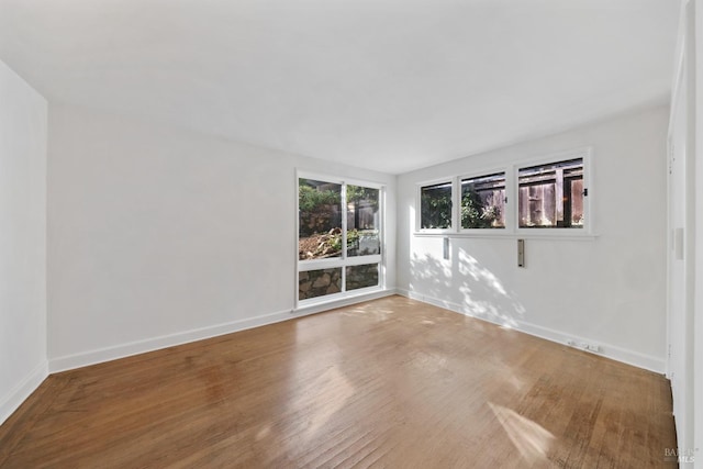 empty room with wood-type flooring