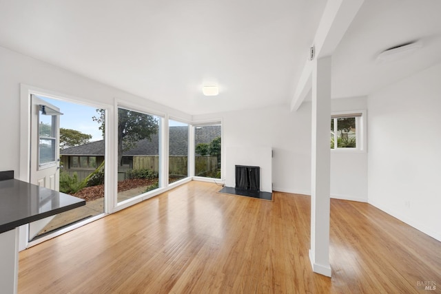 unfurnished living room featuring light wood-type flooring